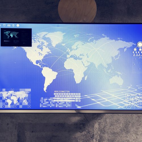 Cyber space table with a world map on screen