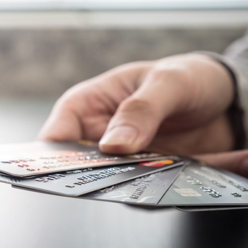 Male hands holding credit cards, soft focus, Online shopping concept.